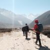 Trekkers hiking toward Himalayan peaks on the Everest Base Camp trail in Nepal
